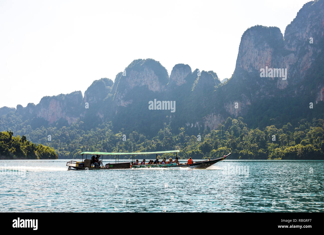 Boat with tourists sailing on the lake in Khao SOK national Park. Sunny day 22 December 2018 Stock Photo