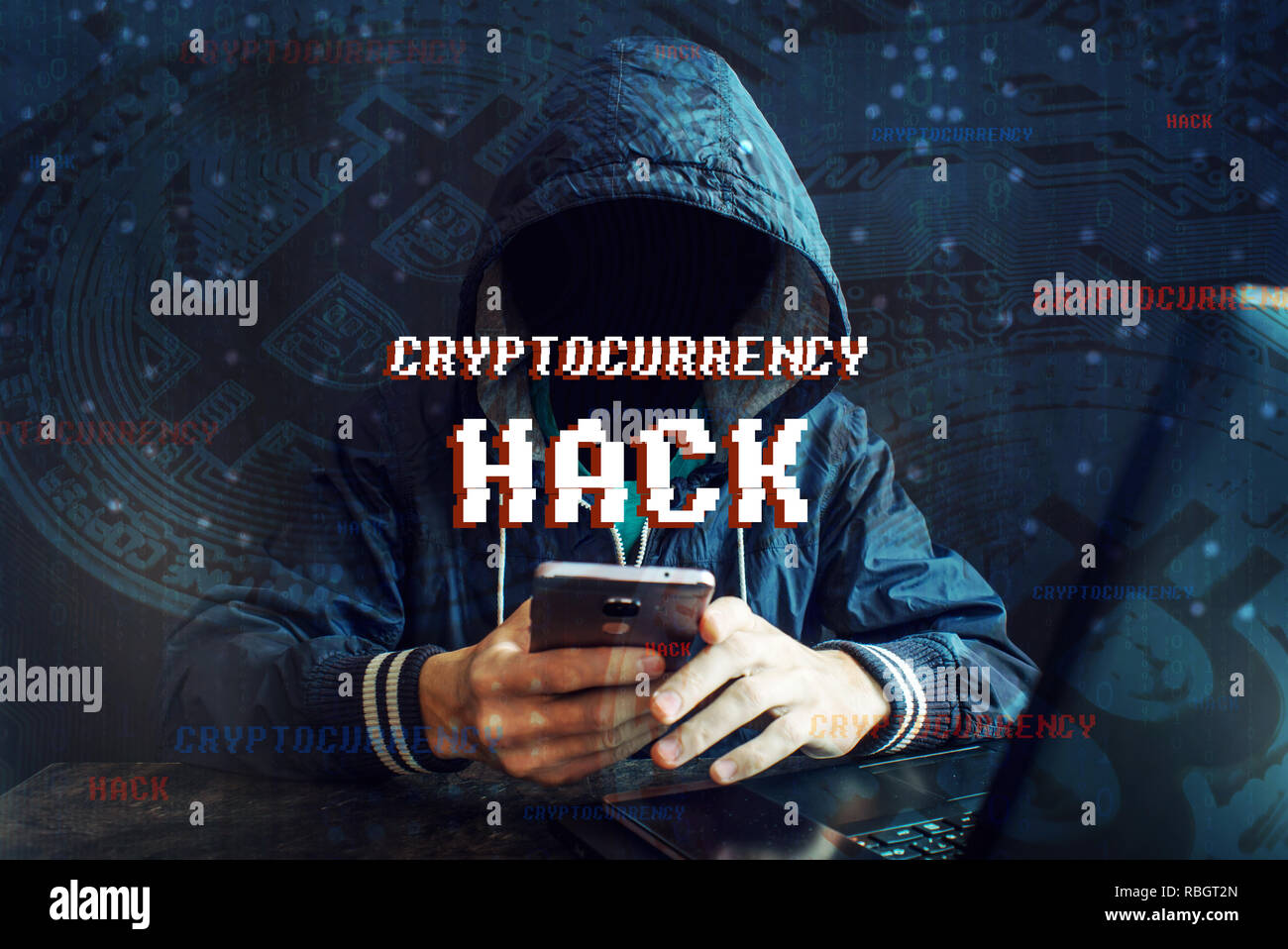 An anonymous hacker without a face is trying to steal cryptocurrency using a computer. Fraud and deception at Cryptojacking Stock Photo