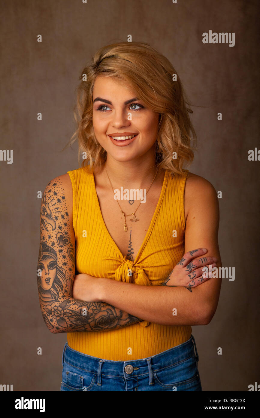 Portrait of beautiful woman with tattoos. Stock Photo