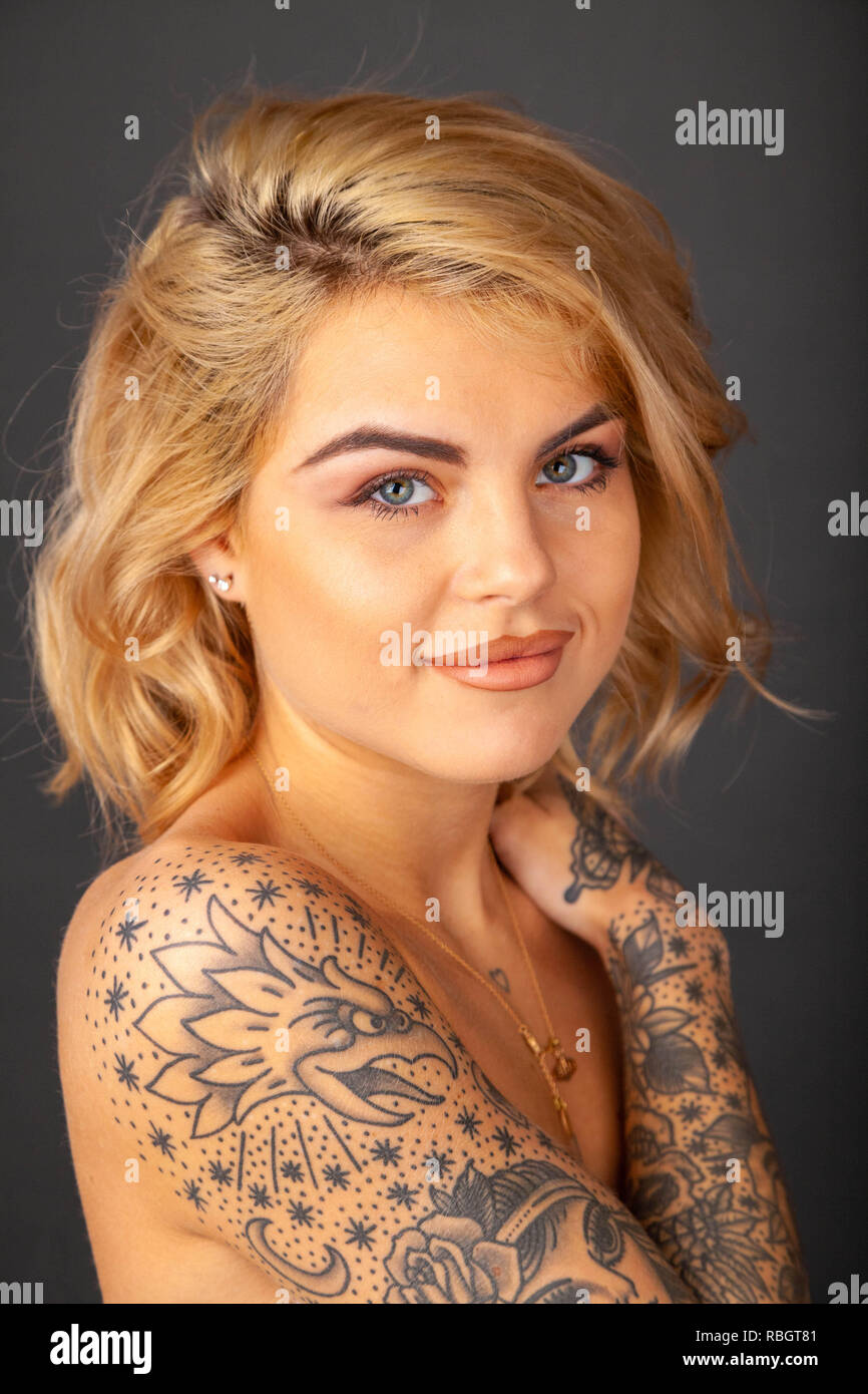 Portrait of beautiful woman with tattoos Stock Photo - Alamy