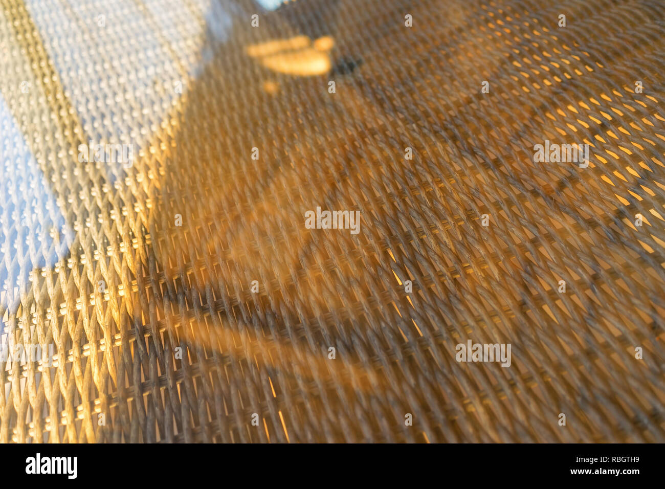 Rattan table under glass Stock Photo Alamy