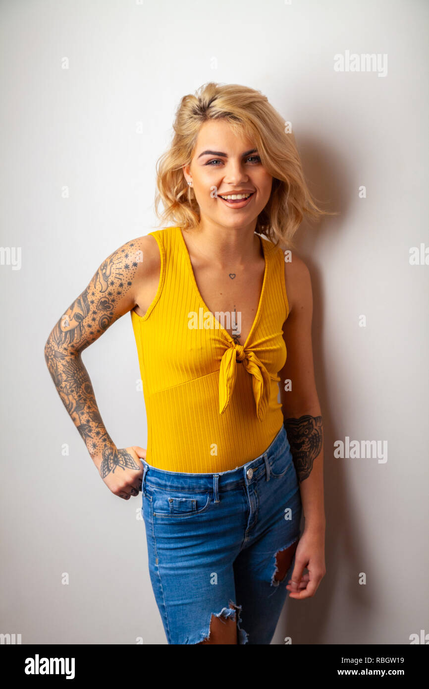 Portrait of beautiful woman with tattoos. Stock Photo
