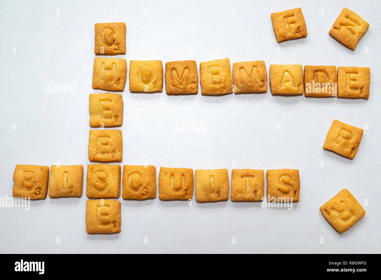 Homemade cheese biscuits - scrabble words made from biscuits / cookies. Stock Photo