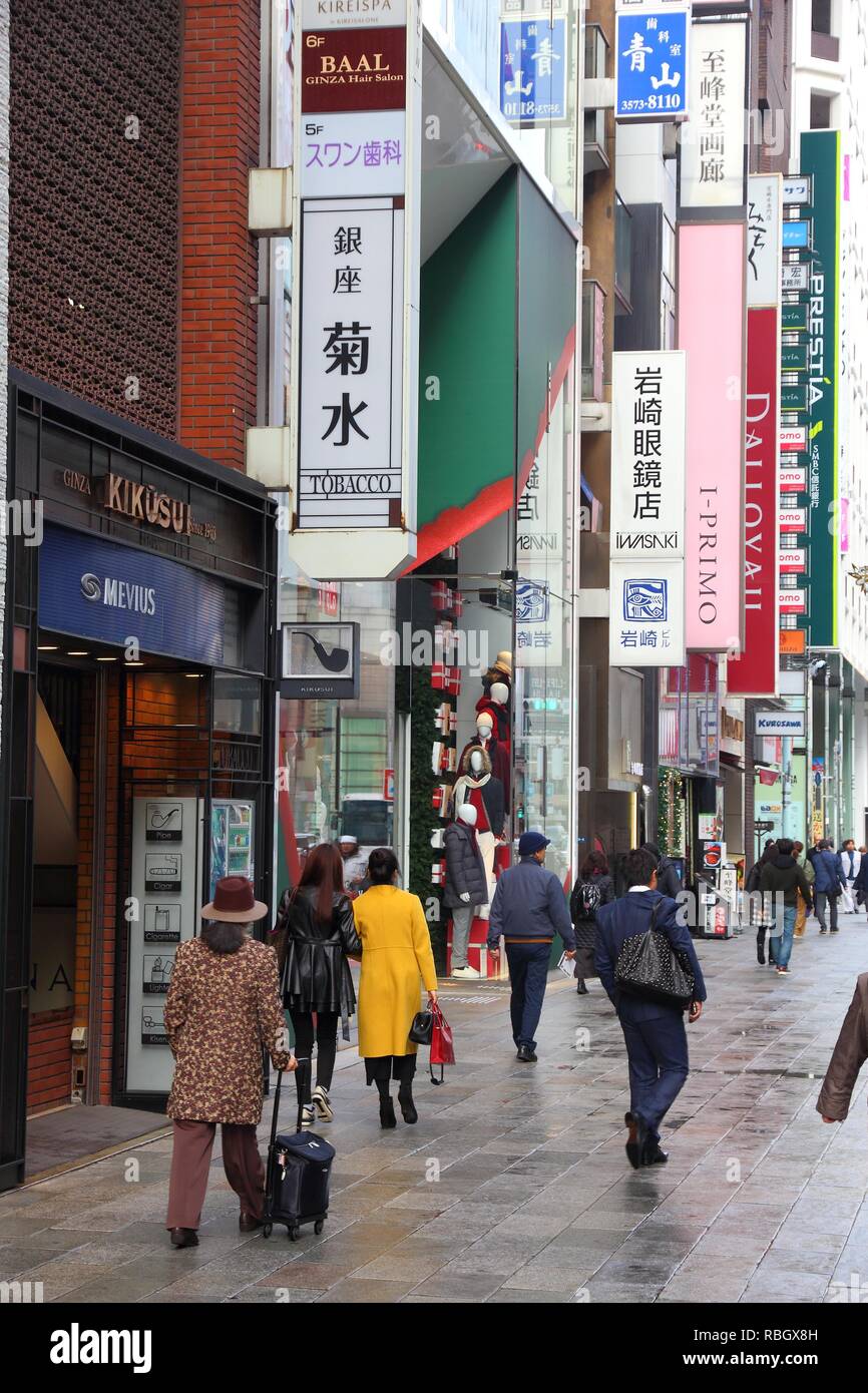 TOKYO, JAPAN - DECEMBER 1, 2016: People shop in Ginza district of Tokyo, Japan. Tokyo is the capital city of Japan. 37.8 million people live in its me Stock Photo