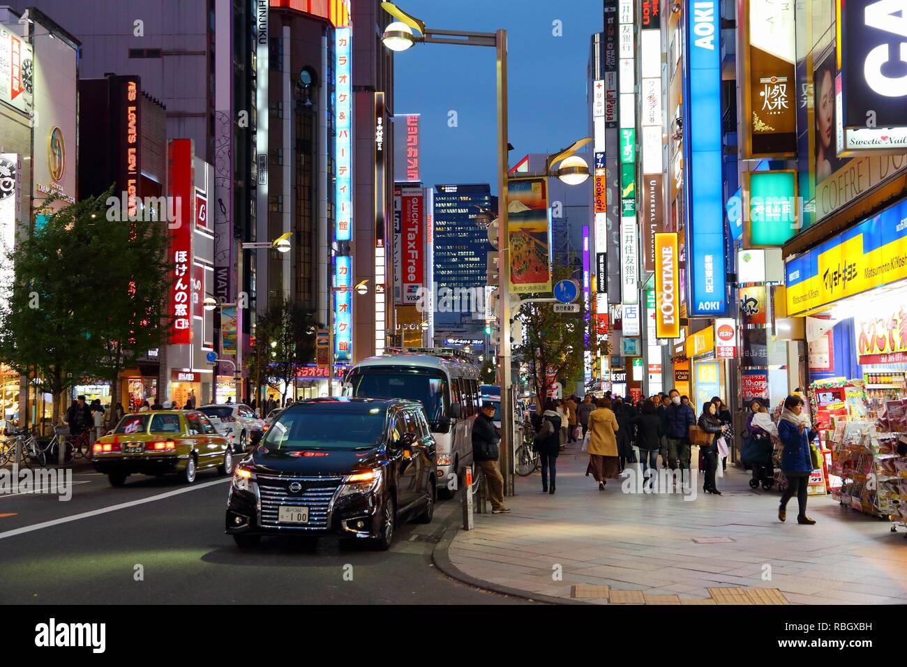 TOKYO, JAPAN - NOVEMBER 30, 2016: People visit Shinjuku district of Tokyo, Japan. Tokyo is the capital city of Japan. 37.8 million people live in its  Stock Photo
