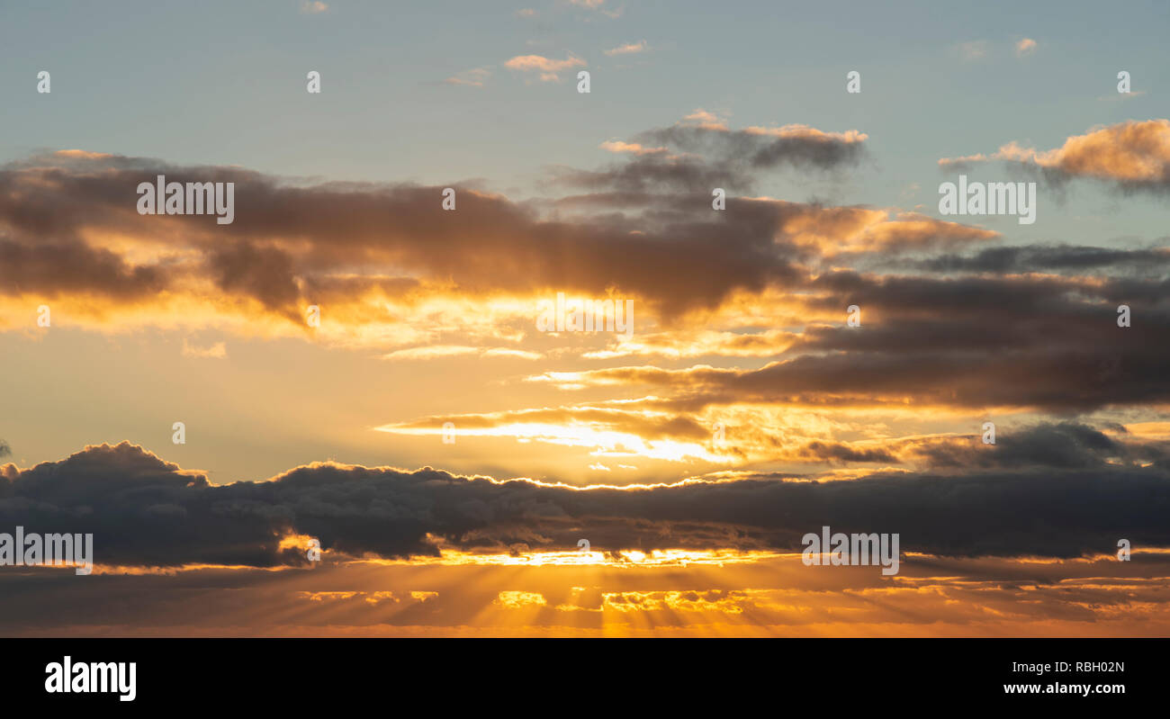 Beautiful colorful golden hour sunset sky with cloud formation and ...