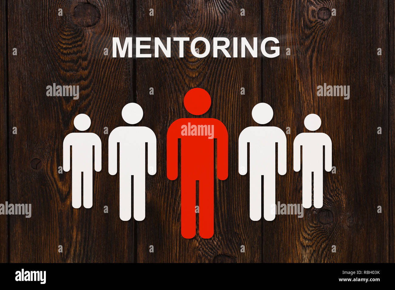 Abstract mentoring concept. Paper red mentor and white men figures on ...