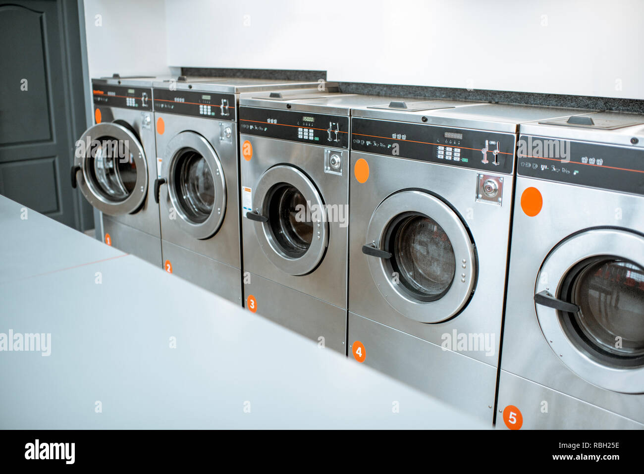 Professional washing machines at the self-service laundry Stock Photo