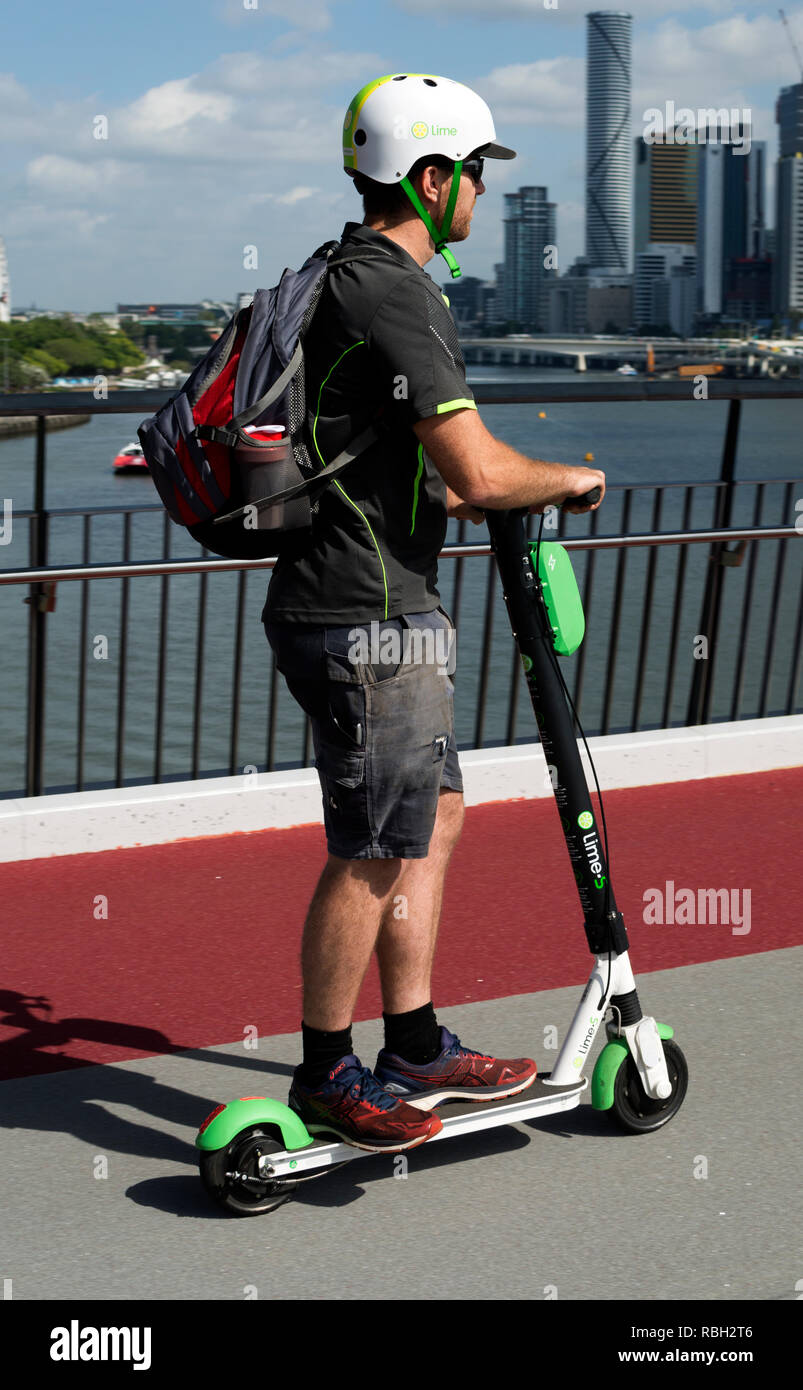 A person riding a Lime-S electric scooter across Goodwill Bridge, Brisbane,  Queensland, Australia Stock Photo - Alamy