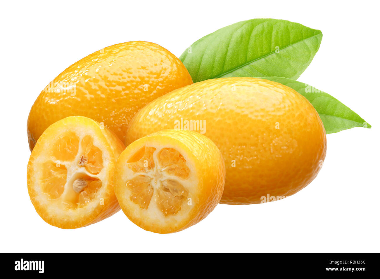 Kumquats (Citrus japonica fruits) group of three with leaves Stock