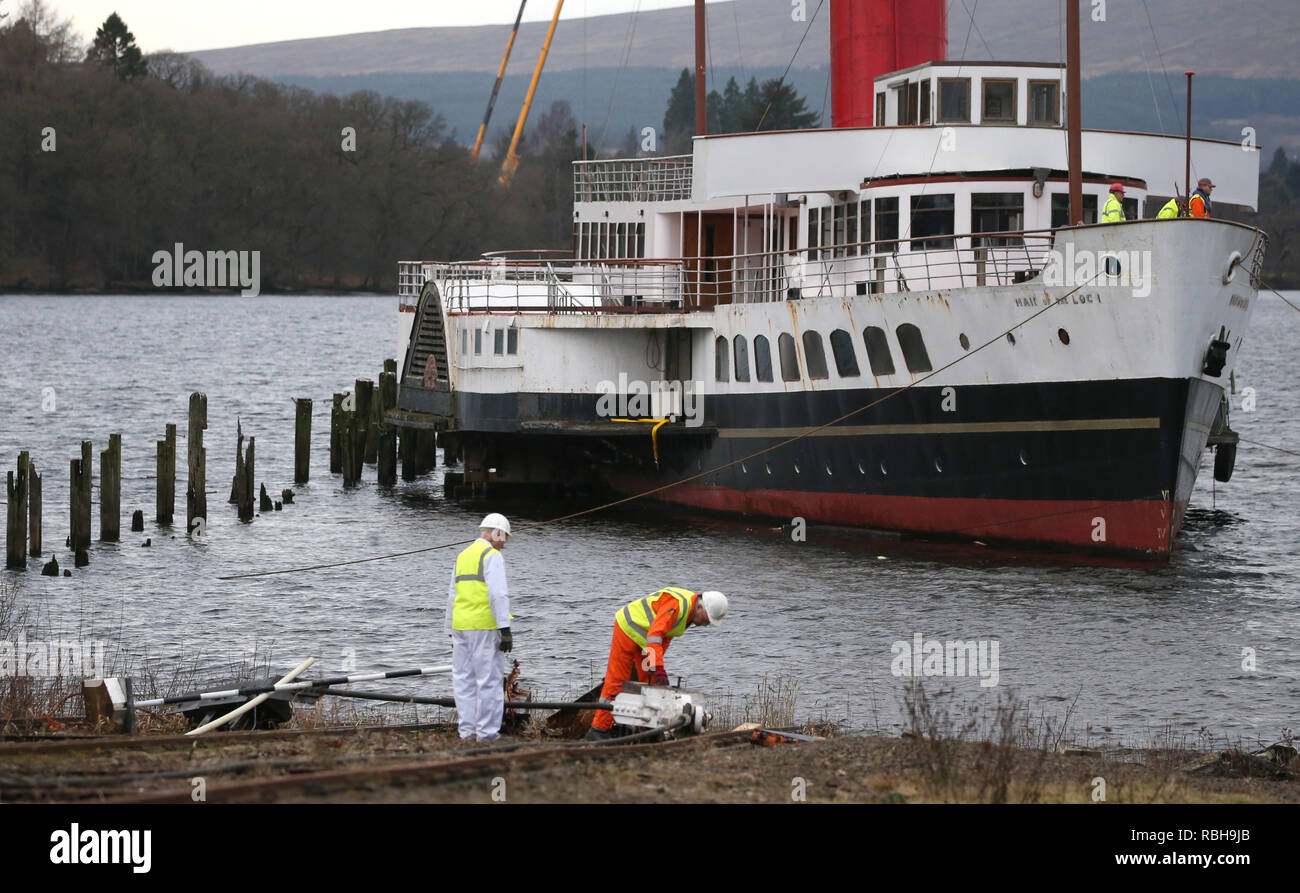 Damage to the craddle carrying the Maid of the Loch is assesed after it snapped during the 'slipping' of the historic steamer being hauled out the water by the original winchhouse and onto the Balloch Steam Slipway, Balloch. Stock Photo