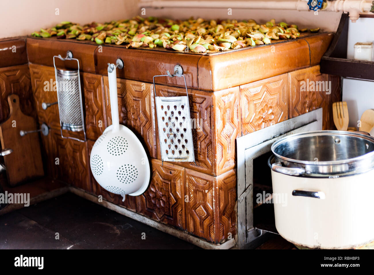 Old teapot on the stove. Kitchen on the old traditional way. Kitchen