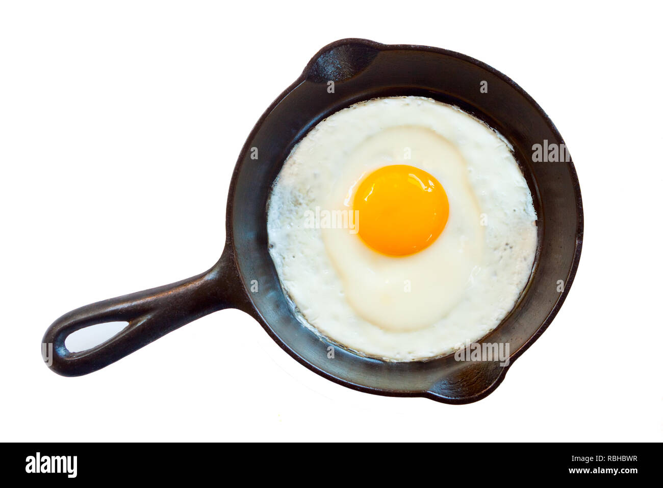 Cast iron pan with fried egg Stock Photo