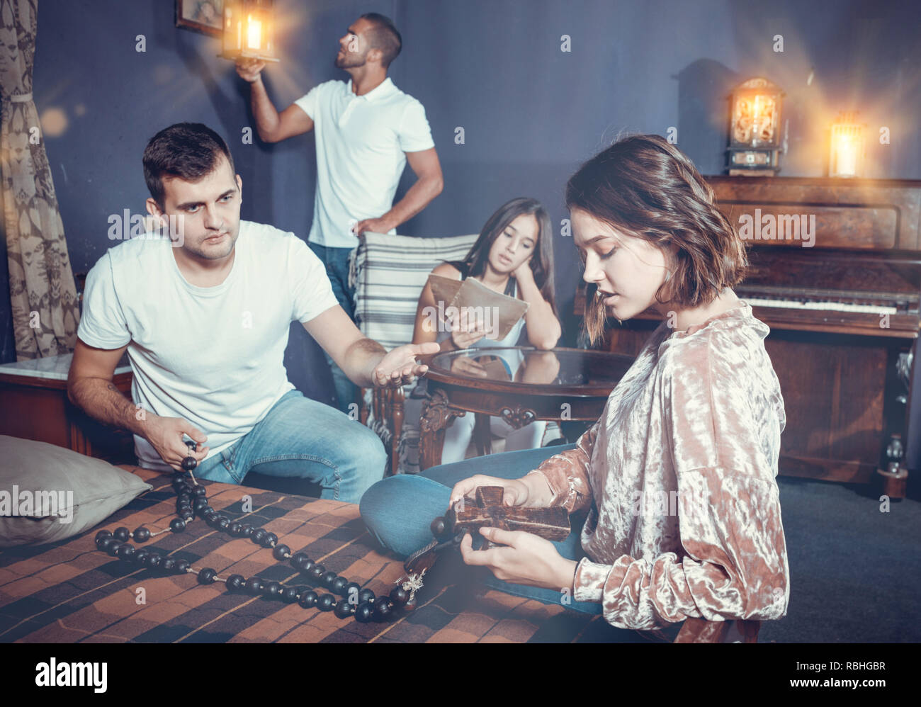 Young People Looking At Old Wooden Rosary While Pursuing