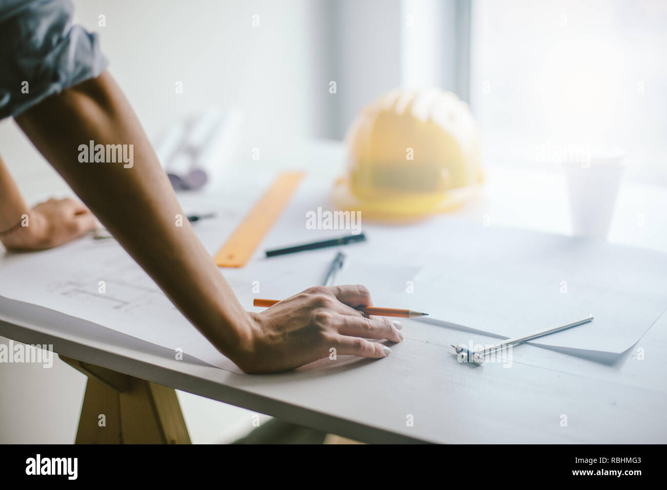 Construction engineering. Close up of engineers hands working on table Stock Photo