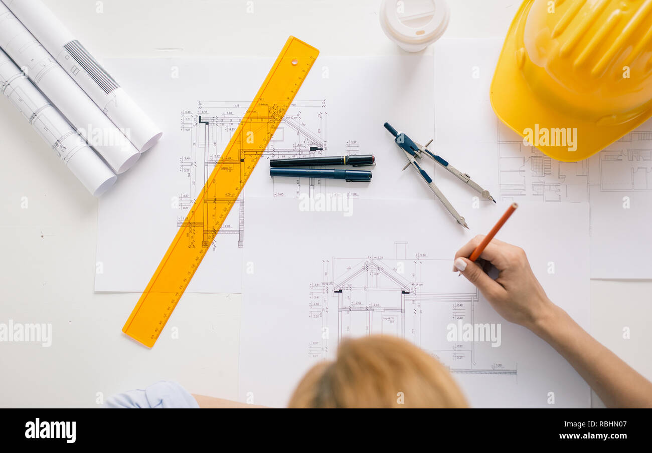Architect drawing blueprints. Architectural/engineering project concept