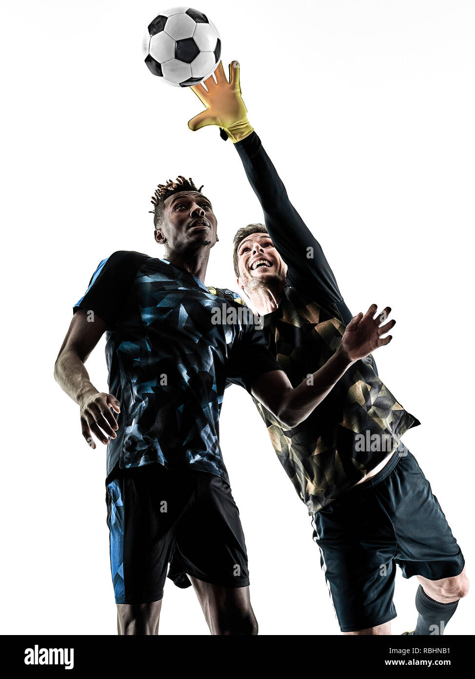 two soccer players goalkeeper men in studio silhouette isolated on white background Stock Photo