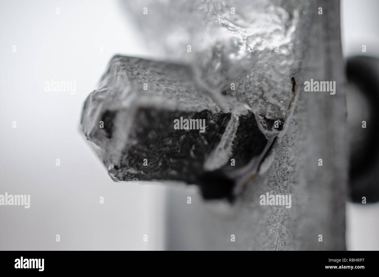 Icy bolt nut close-up Stock Photo