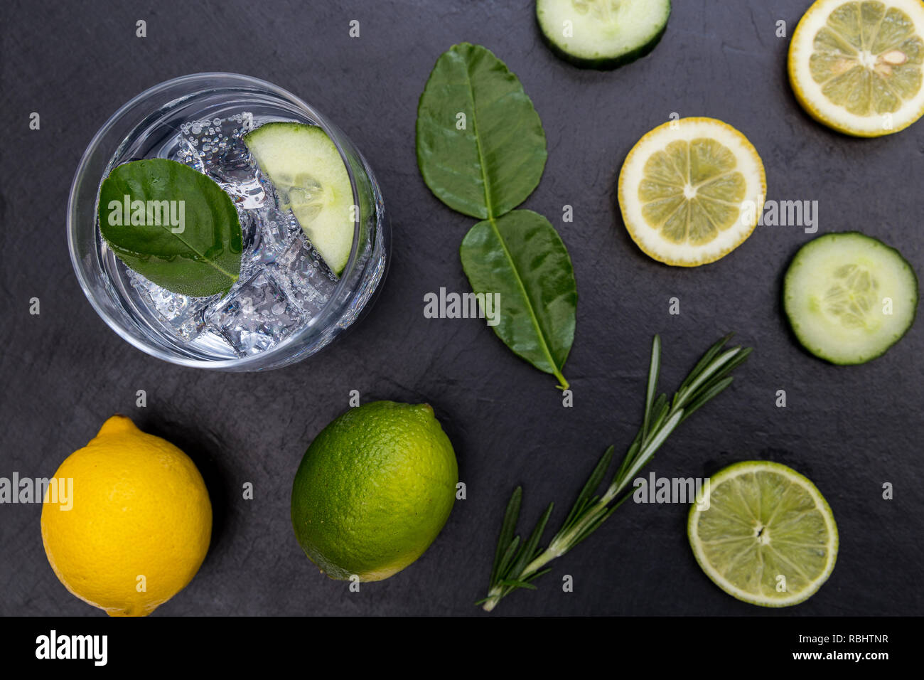 Gin tonic cocktail drink glass with ice cucumber lime lemon dark background Stock Photo Alamy