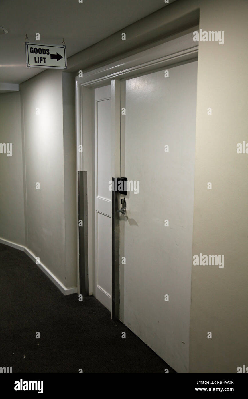 the entrance door to a goods lift (or service lift) within a hotel in South Africa Stock Photo