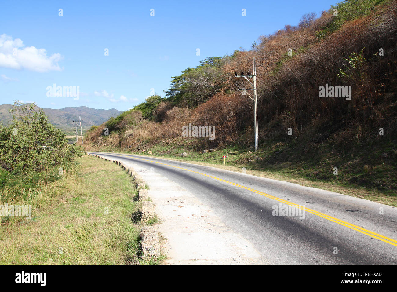 Countryside road in Cuba, near Trinidad. Asphalt road. Stock Photo