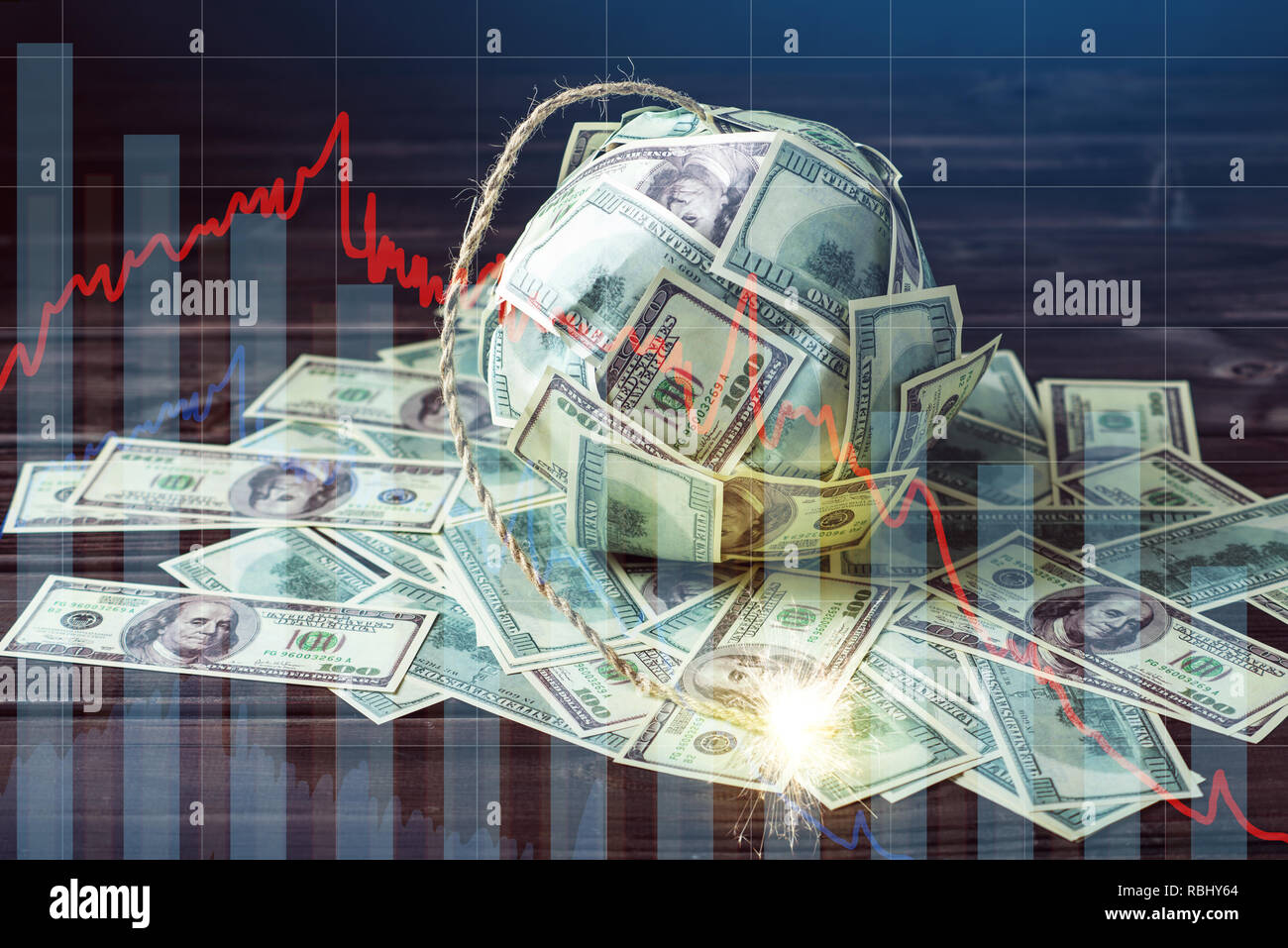 Big bomb of money hundred dollar bills with a burning wick. Little time before the explosion. The concept of financial currency crisis Stock Photo