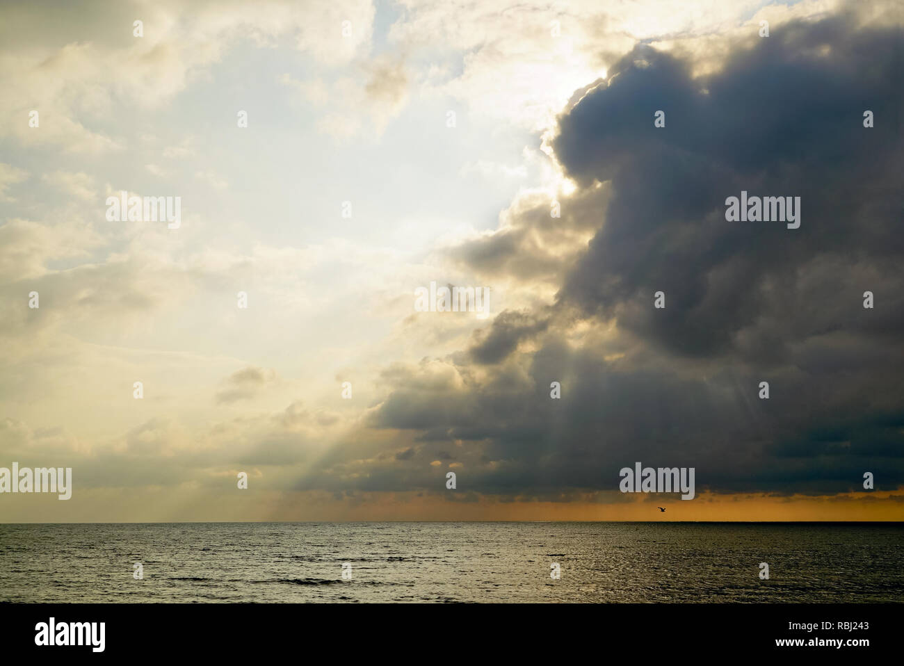 The sun breaks through the clouds above the sea . Tarhankut. Crimea ,Russia. Stock Photo