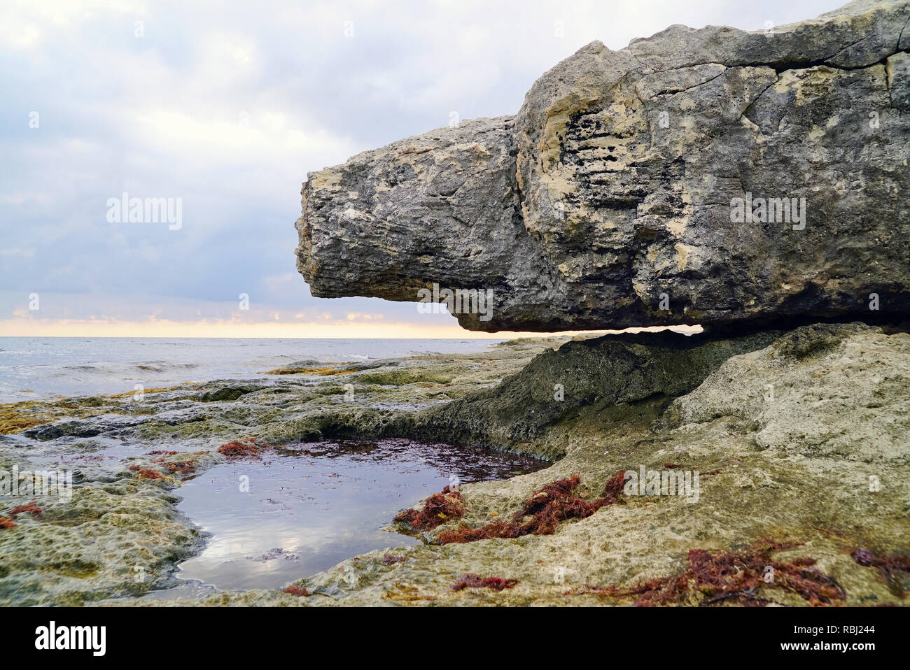 The cliff hangs over the sea shore . Tarhankut. Crimea ,Russia Stock Photo