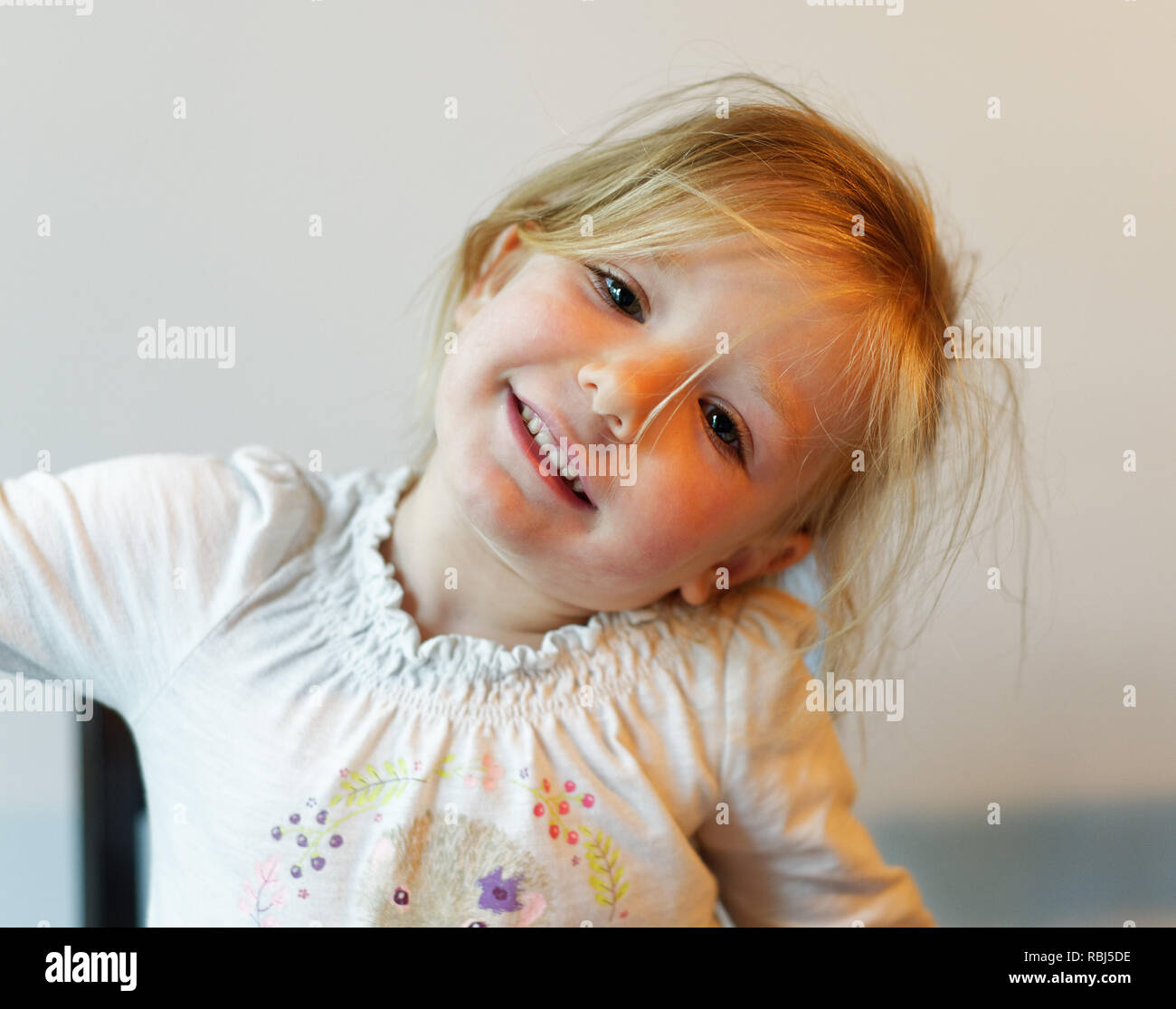 A portrait of a beautiful smiling four year old girl Stock Photo