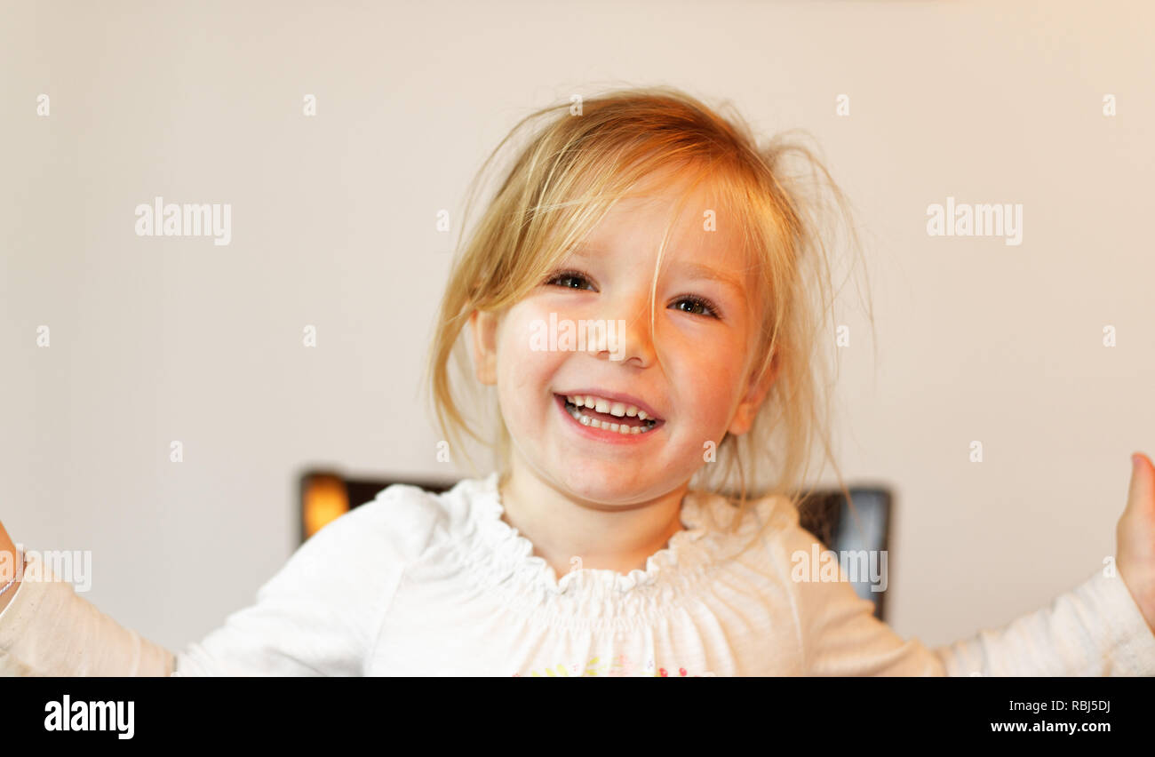 A portrait of a beautiful smiling four year old girl Stock Photo