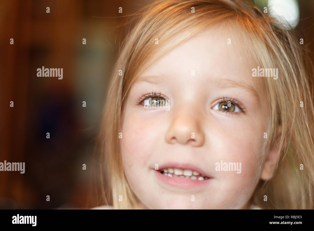 A portrait of a beautiful smiling four year old girl Stock Photo