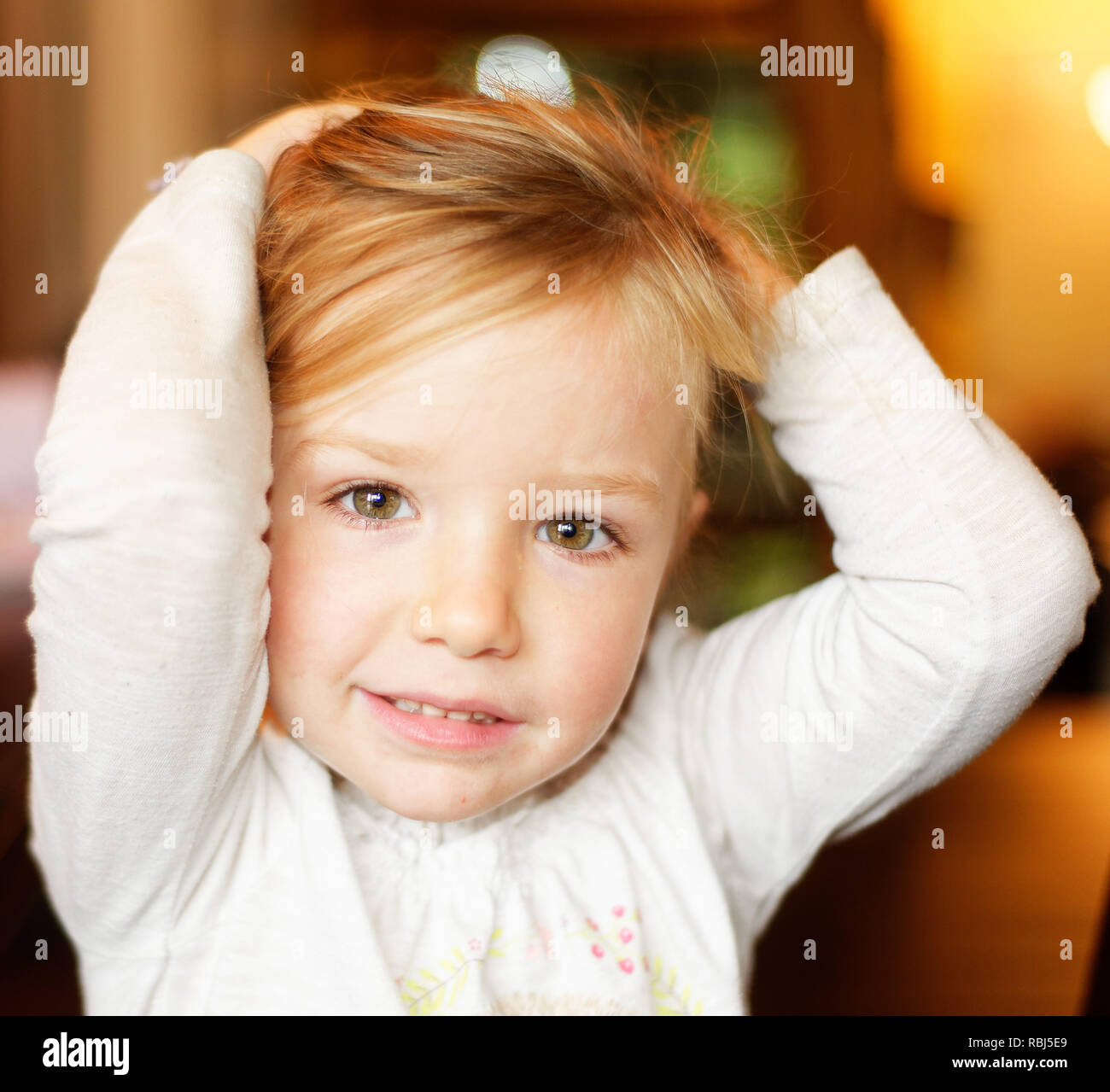 A portrait of a beautiful smiling four year old girl Stock Photo