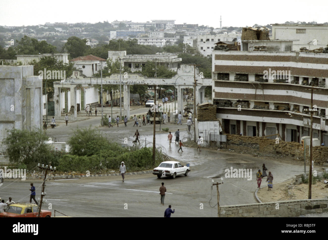 10th October 1993 The K-4 roundabout in Mogadishu, Somalia. In the background is the Arco di Trionfo Popolare (the People's Arch of Triumph), a remnant of colonial rule under Italy. Stock Photo