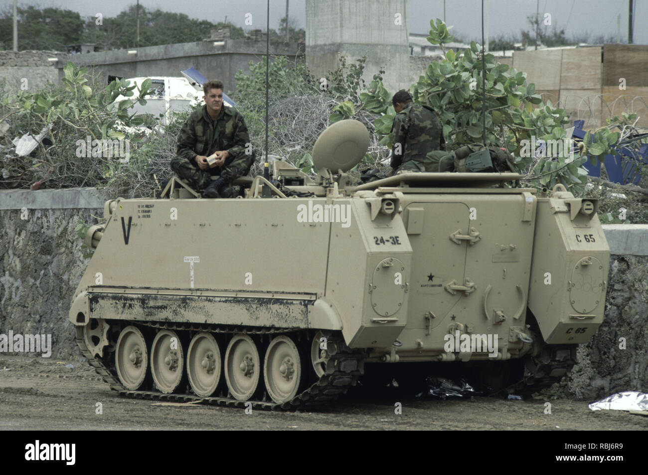 10th October 1993 Two U.S. Army soldiers sit on top of their M113 APC. They have just arrived at Mogadishu Airport in Somalia. Stock Photo