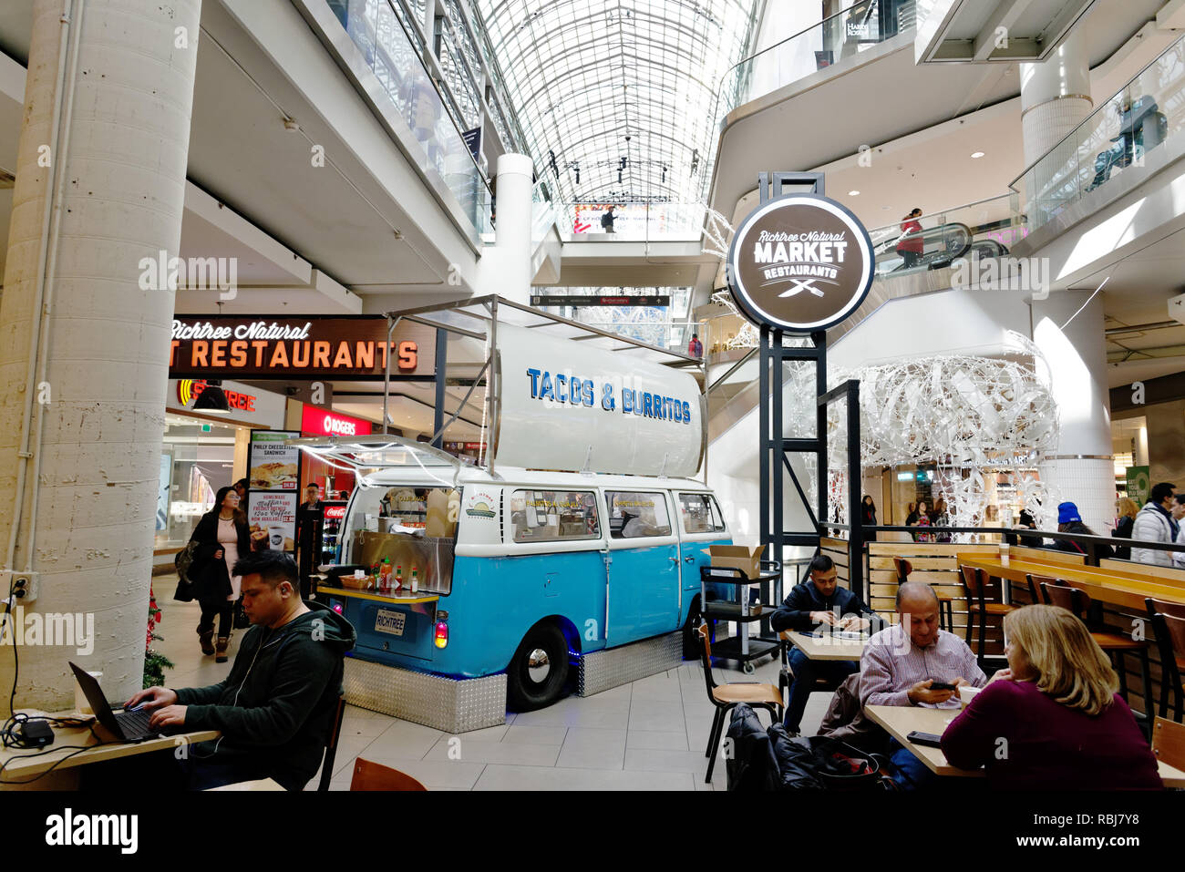 A taco and burrito stall set up in a VW camper van in the fast food
