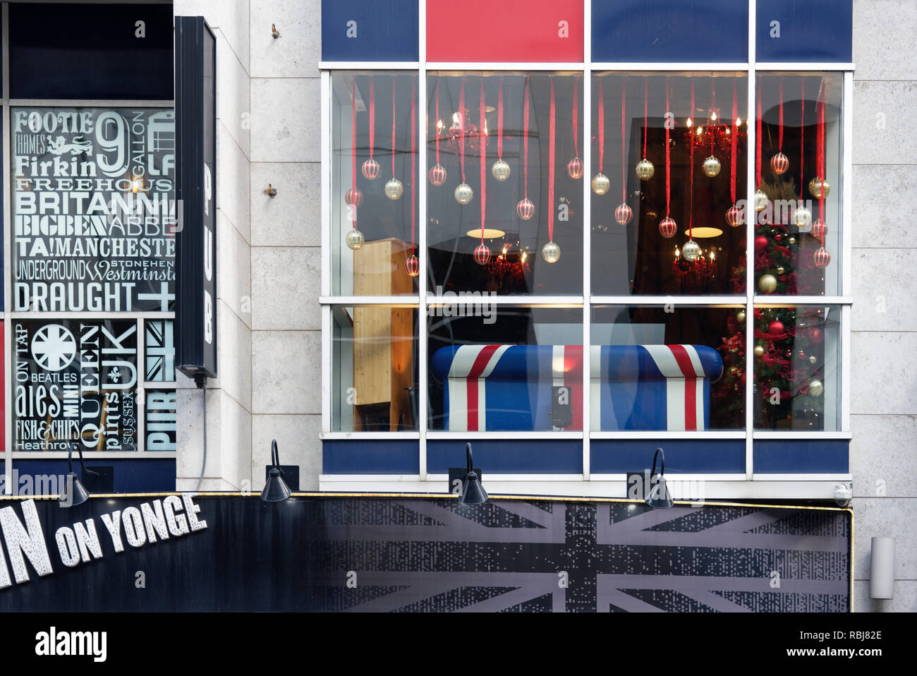 A union jack sofa in a pub window on Yonge Street in Toronto, Canada