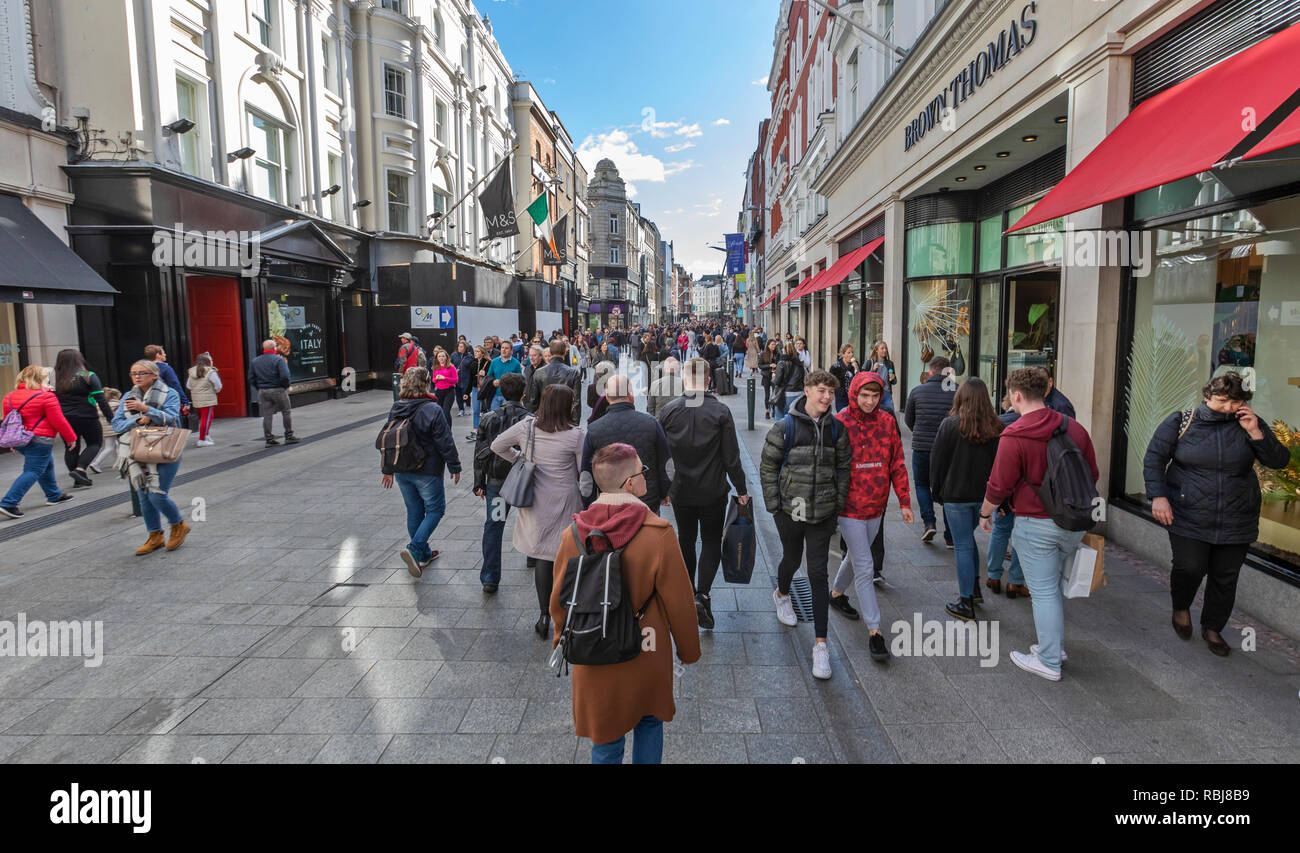 People, families, tourists walking and exploring Grafton St., a busy