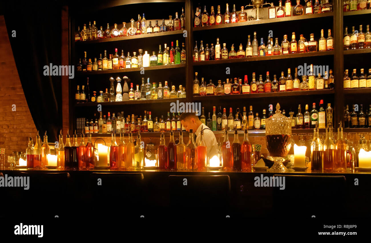 The barman behind the bar inside Bar Chef cocktail bar in Toronto, Canada Stock Photo