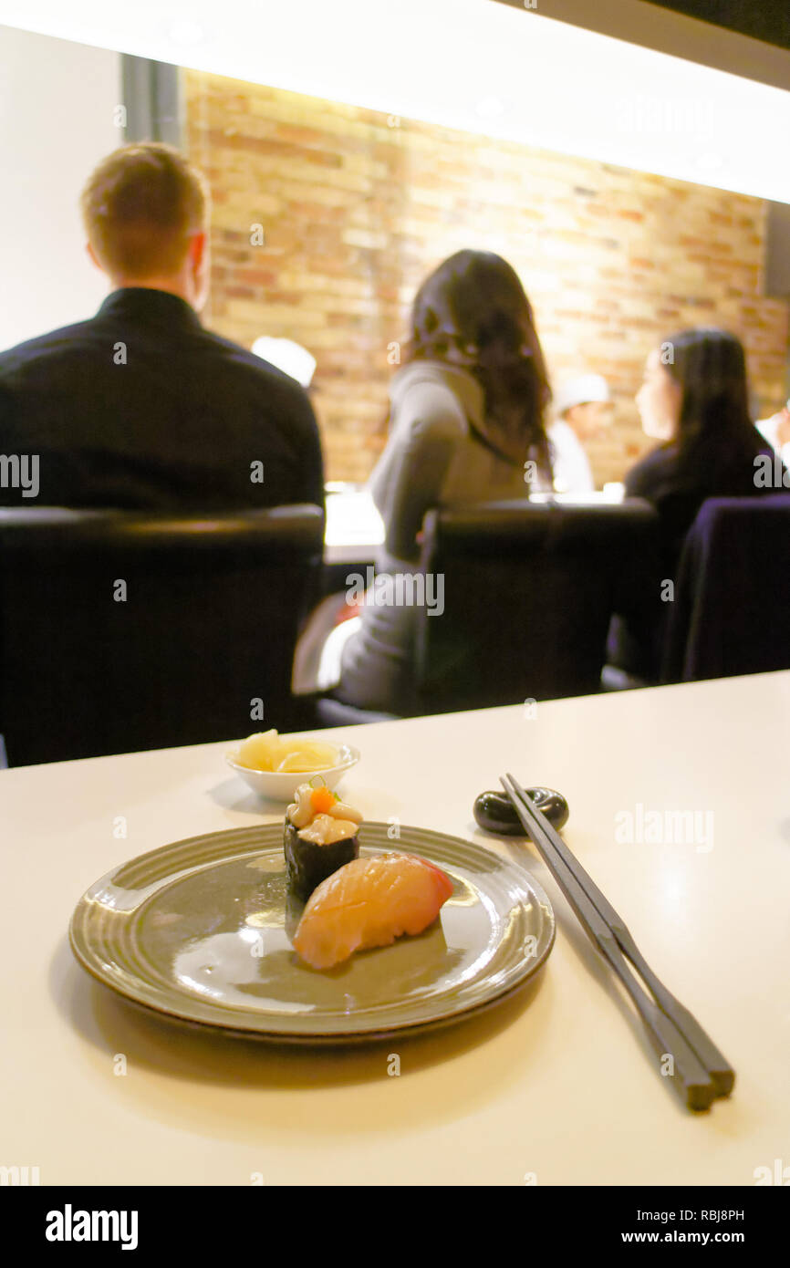 A plate of edomae sushi with stripjack fish and cod testicles in Yasu Omakase Sushi Bar in Toronto, Canada Stock Photo