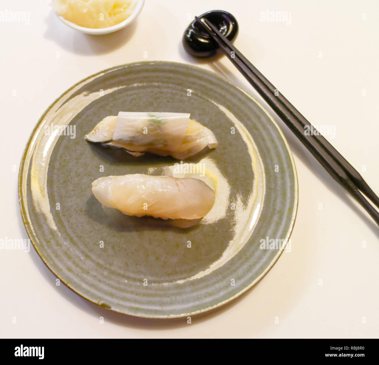 A plate of grouper and mackerel sushi in Yasu Omakase Sushi Bar in