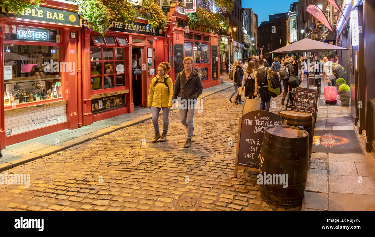 Visitors and tourists explore the Temple Bar district in Dublin