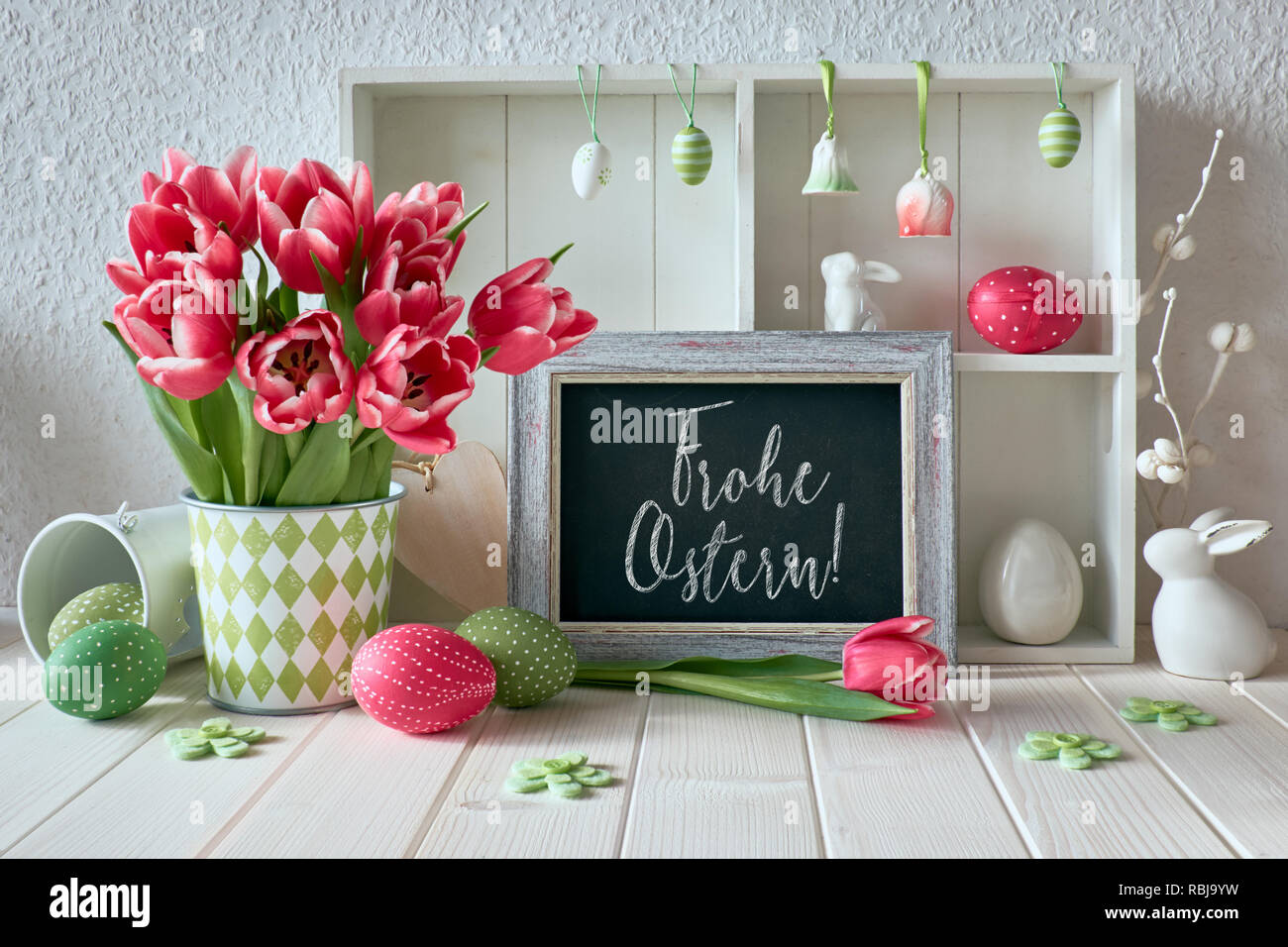 Springtime Background With Easter Decorations Tulips And A Chalk