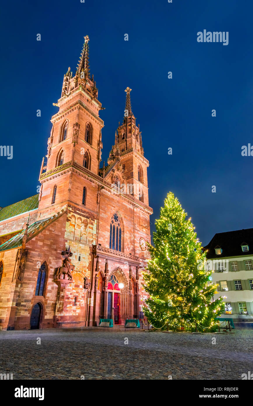 Basel, Switzerland. Christmas fairytale market at Munsterplatz and Munster Cathedral, Swiss Confederation. Stock Photo