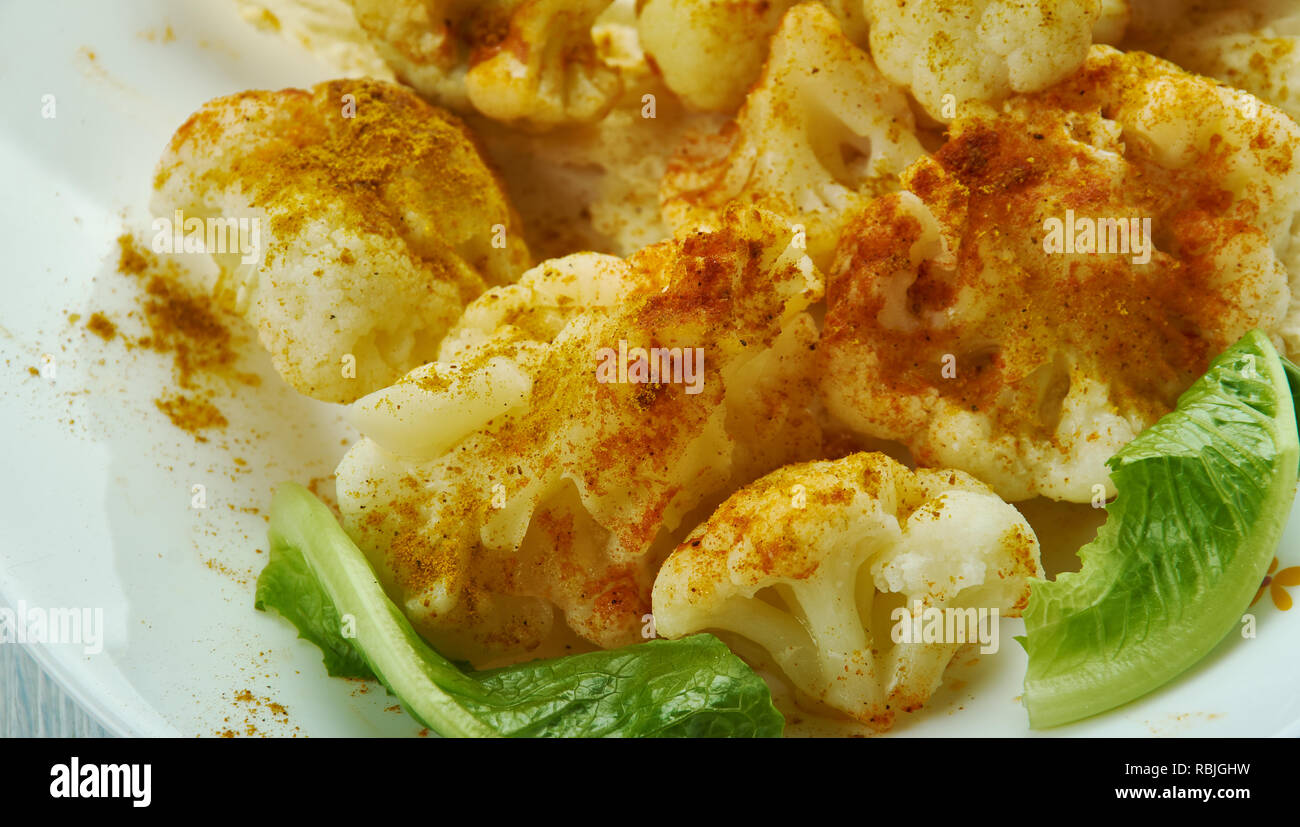 Spicy Roasted Cauliflower with Turmeric Stock Photo - Alamy