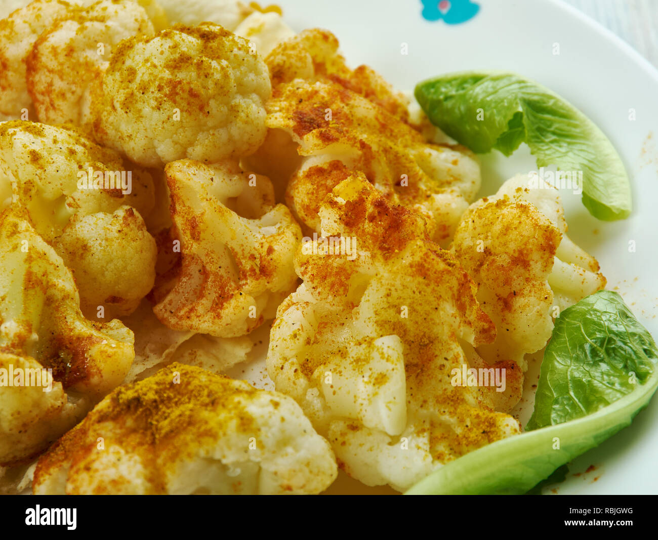 Spicy Roasted Cauliflower with Turmeric Stock Photo - Alamy