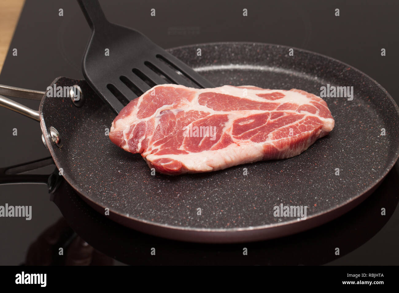 Close Up Picture Of A Beautiful Raw Pork Steak In A Non Stick