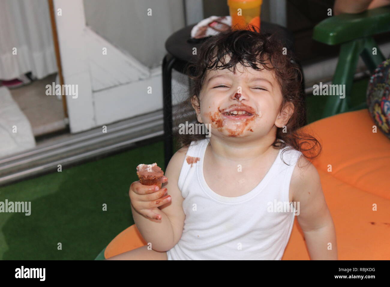 young girl smiling with ice cream Stock Photo