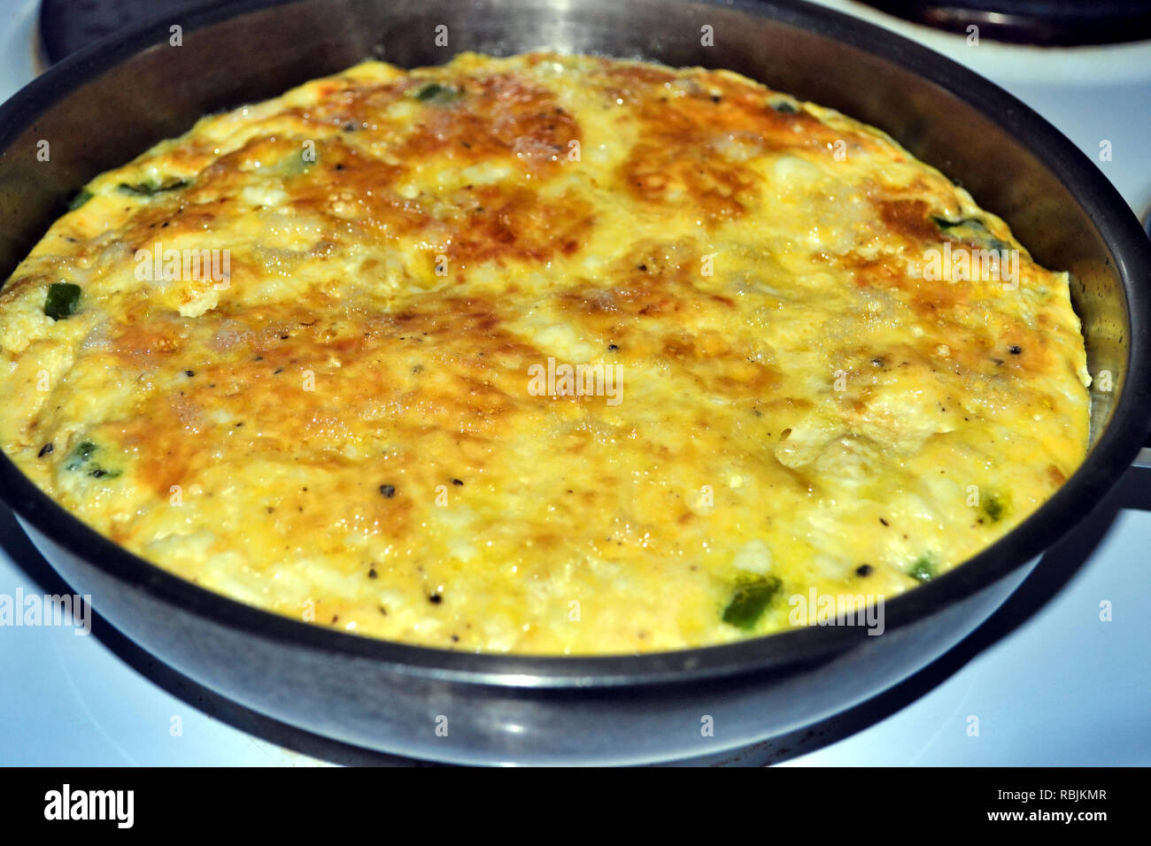 omelette cooking in pan Stock Photo Alamy