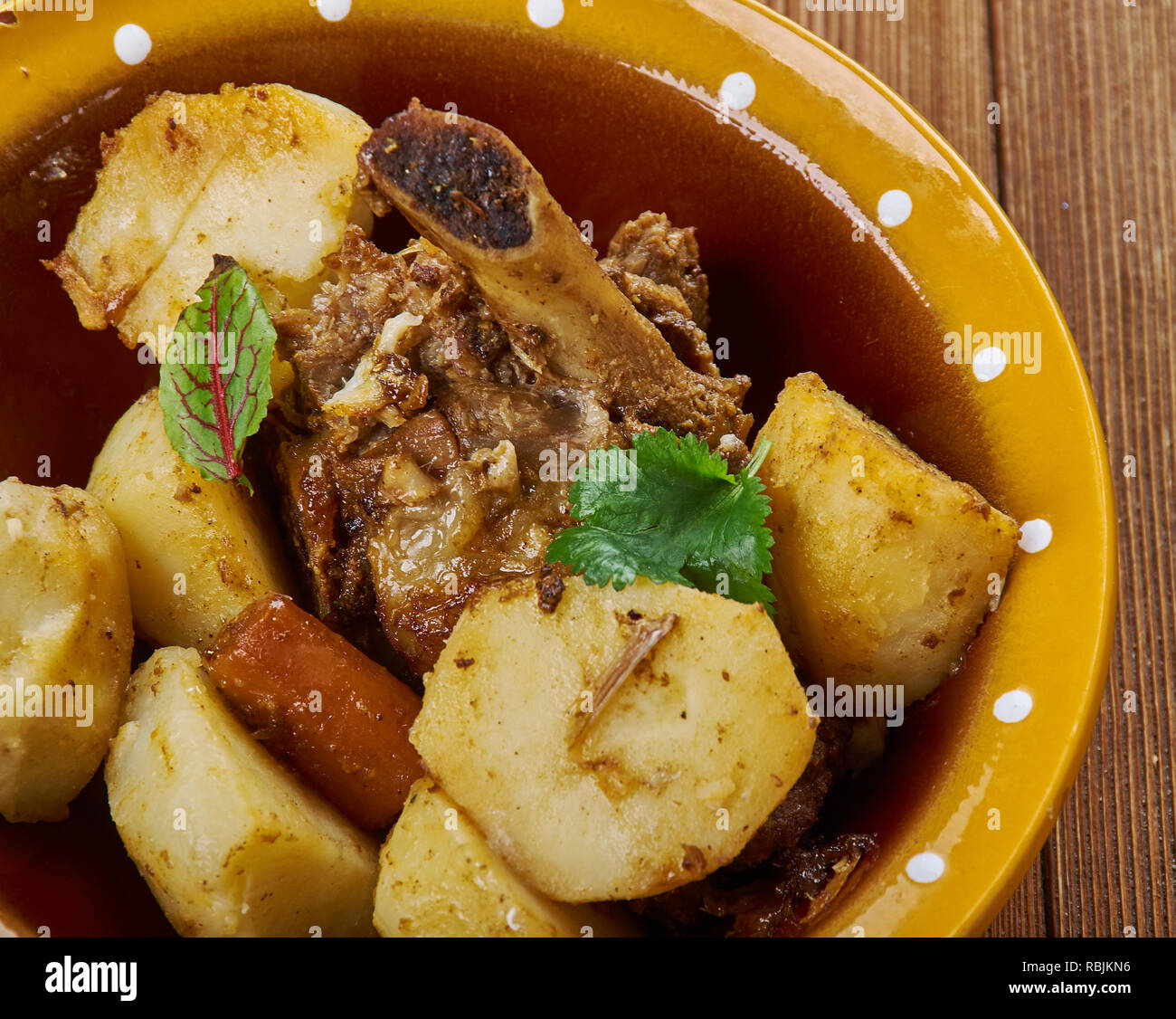 Greek lamb kleftiko with potatoes, oregano and lemon Stock Photo Alamy