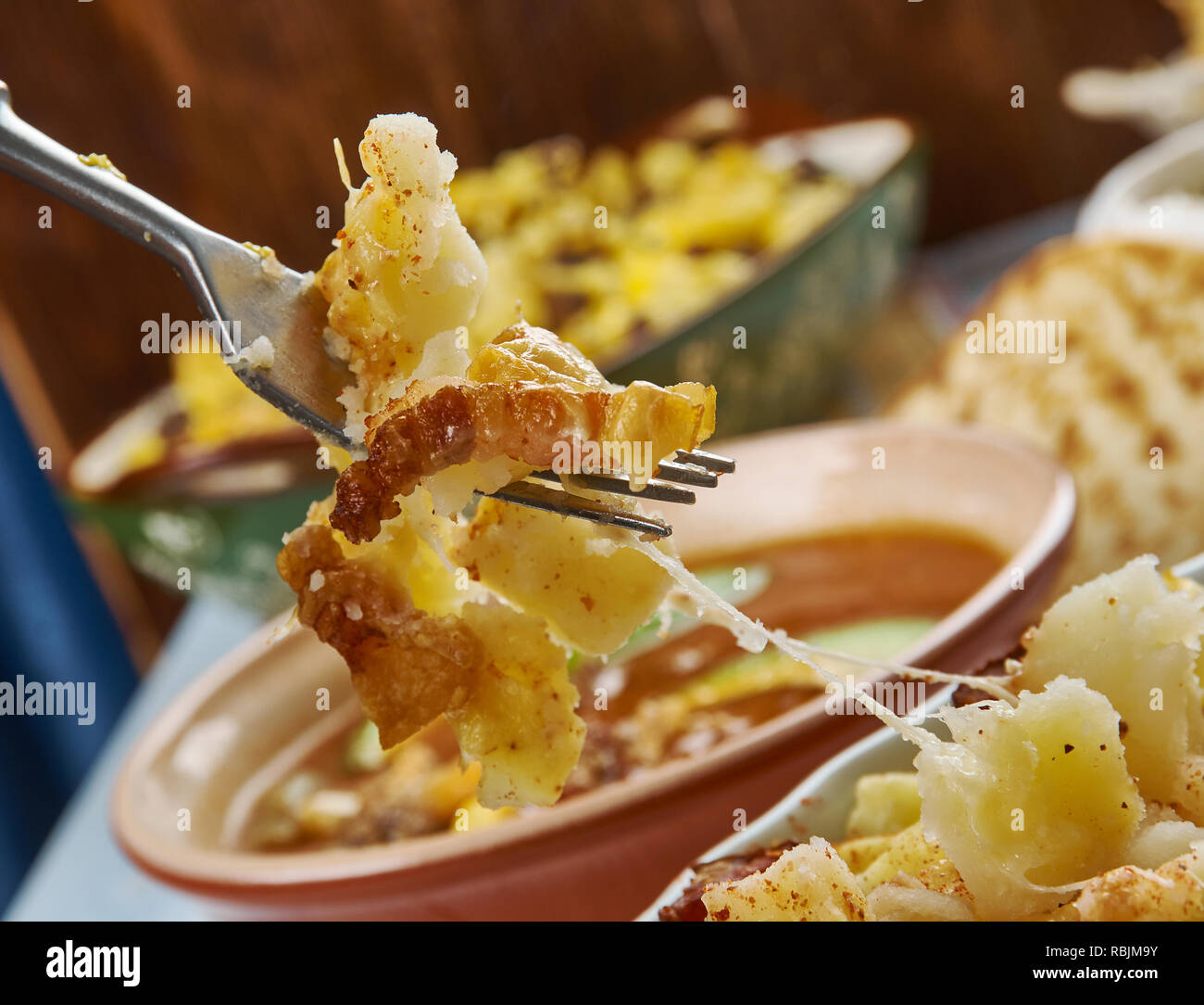 Ranch Potatoes, combine ranch dressing, taco seasoning, and half the shredded cheddar cheese